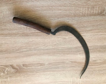 Large antique forged sickle of the first half of the 20th century with a wooden handle from Ukraine, farming tool