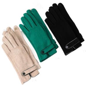 May include: Three pairs of gloves in beige, emerald green, and black. Each pair features a buttoned cuff with a contrasting trim. The gloves are made of a soft material, suitable for cold weather.