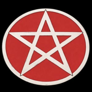 May include: A circular emblem with a white pentagram on a red base, framed by a silver border. The design is set against a black background. The emblem's shape is circular.