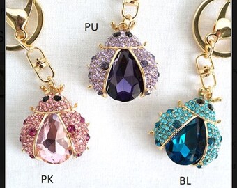 Llavero con forma de mariquita y cristales de imitación para bolso.
