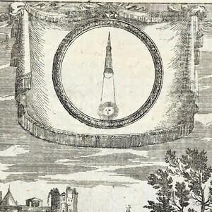 May include: An antique black and white illustration featuring a circular design with a central, elongated shape and a sun with a face at the bottom. The design is framed by a decorative border and draped fabric, with a cityscape and trees in the background.