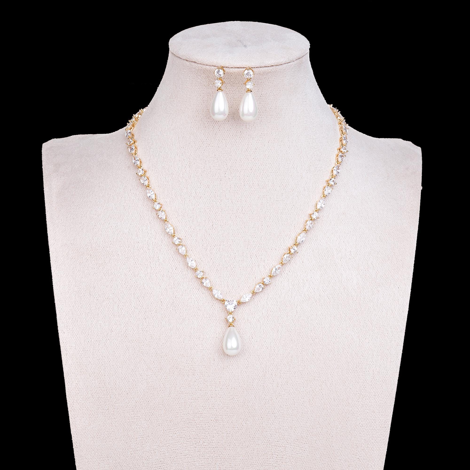 Exclusive New Luxury 18k Gold Plated jewellery set with Titanic Chain & 5A Cubic Zirconia with Shell Pearl Drops.