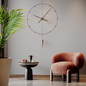 May include: A contemporary wall clock with a black metal frame and hands, hanging on a wall. The clock features a pendulum and is positioned above a small table with a coffee pot and pastries. A peach armchair is also visible.