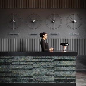 Puede incluir: Recepción de hotel con un mostrador de piedra verde y negra. Encima del mostrador, cuatro relojes minimalistas muestran la hora en Nueva York, Estambul, Londres y Tokio. Una lámpara negra está sobre el mostrador.