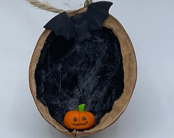 Halloween Decoration in a Nutshell, miniature pumpkin with bat, handmade Walnut Shell decoration