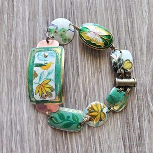 tin bracelet green and yellow bird layered on copper tin link medley of vintage candy tin charm bracelet domed with magnetic clasp butterfly