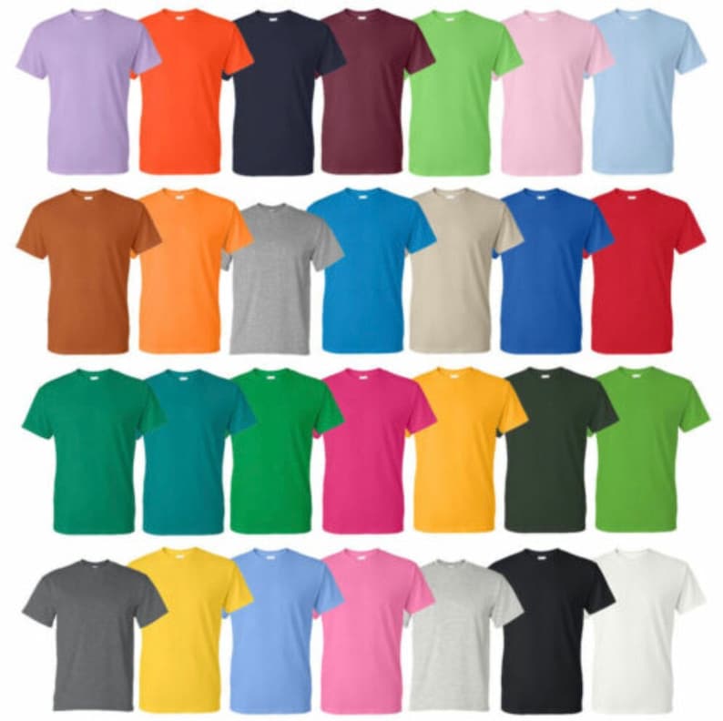 May include: A collection of twenty-four short-sleeved t-shirts in various solid colors, including shades of blue, green, orange, pink, and neutral tones. The shirts are neatly arranged, showcasing a range of hues.