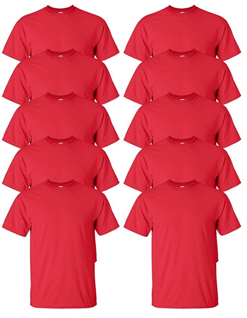 May include: A collection of ten solid red crew neck t-shirts. The shirts are neatly arranged, showcasing their short sleeves and classic design. The fabric appears to be a medium weight cotton, suitable for casual wear.