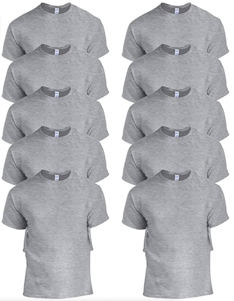 May include: A collection of ten heather gray crew neck t-shirts. Each short-sleeved shirt is neatly folded, showcasing the neckline and shoulders. The shirts are arranged in two columns of five, providing a clear view of the apparel.