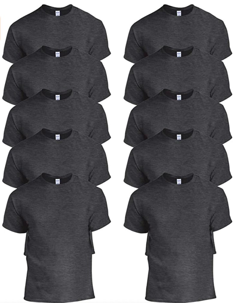 May include: A collection of dark gray crew neck t-shirts. The shirts are neatly stacked, showcasing the short sleeves and the classic neckline. The fabric appears to be a soft, comfortable material, suitable for casual wear. The shirts are displayed in a studio setting.