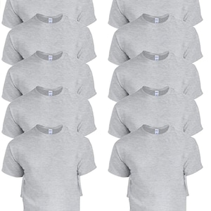 May include: A collection of ten heather gray crew neck t-shirts. Each short-sleeved shirt has a tag attached. The shirts are neatly arranged in two columns of five.
