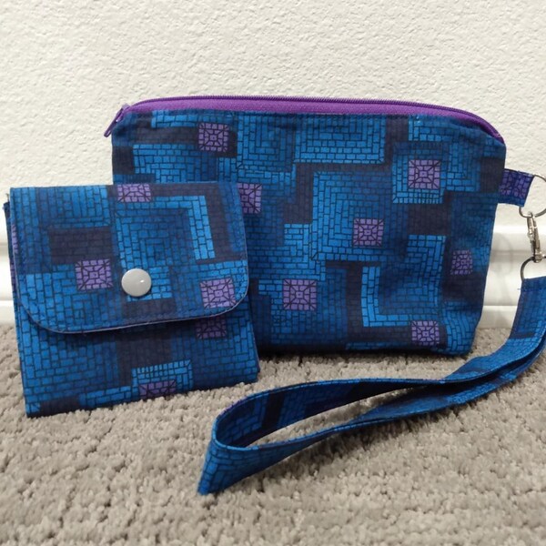 Geometric fabric clutch purse and coin pouch.