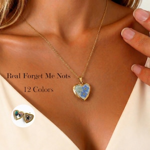 May include: A set of three ceramic mugs with a speckled, matte finish. The mugs are in shades of cream, light gray, and dark gray. Each mug has a simple, minimalist design and a rounded handle.