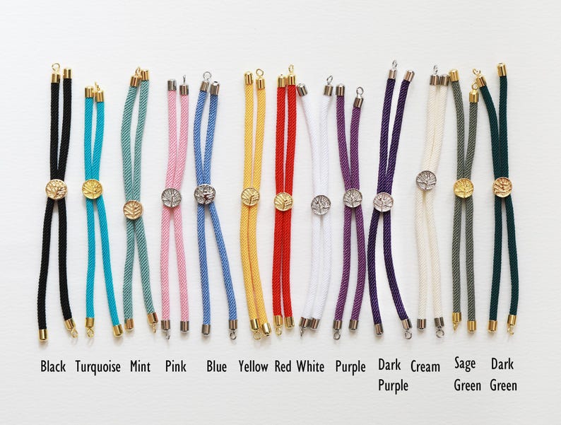 May include: A collection of colorful corded jewelry findings in various colors, including black, turquoise, mint, pink, blue, yellow, red, white, purple, dark purple, cream, sage green, and dark green. Each has a metal clasp and a decorative center piece. The text at the bottom reads: Black Turquoise Mint Pink Blue Yellow Red White Purple Dark Purple Cream Sage Green Dark Green.