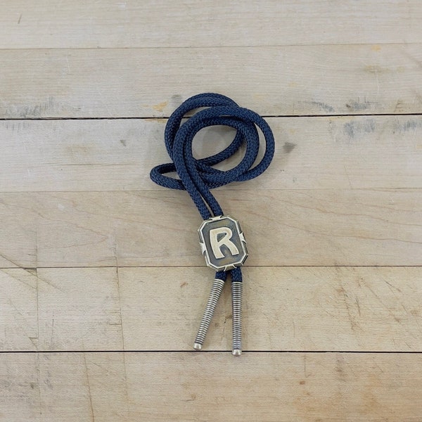 Bolo tie, Brass Letter "R" Bolo Slide on Black Cotton Cord with Brass Metal Tips