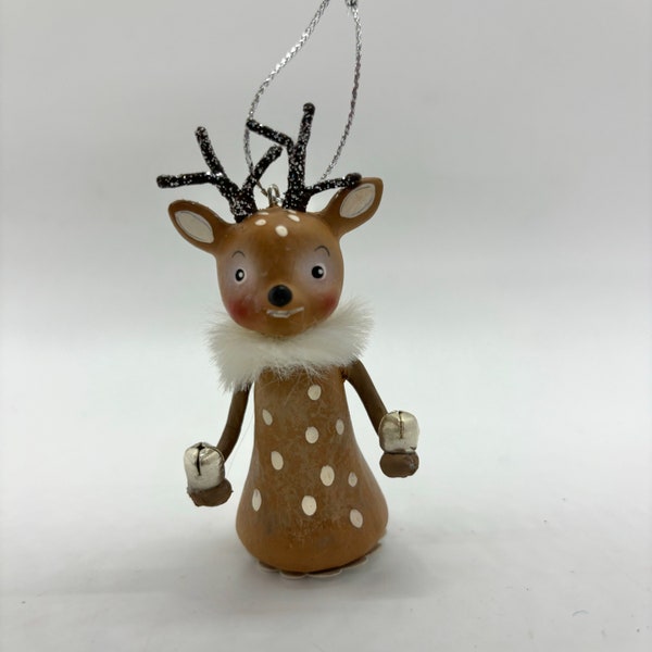 Bethany Lowe Little Reindeer Ornament, Holding a 2 tiny silver Jingle Bells and has a Fur Collar at his neck, and glittered antlers