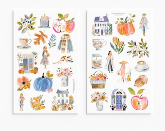 May include: Two sheets of watercolor stickers featuring seasonal illustrations including houses, pumpkins, apples, floral arrangements, coffee cups, candles, scarves, and figures in coats. The designs are rendered in soft, varied color palettes.