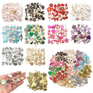 May include: Assortment of colourful enamel charms with various designs, including hearts, stars, flowers, animals, and geometric shapes. The charms are made of metal and have a shiny finish. They are perfect for adding a touch of personality to jewellery, keychains, and other crafts.