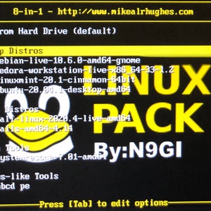 May include: A black screen with yellow text displays a menu of operating systems, including Debian, Fedora, Linux Mint, Ubuntu, Kali Linux, Tails, SystemRescue, and HBCD. The text "8-in-1 - http://www.mikealrhughes.com" is at the top of the screen. The text "LINUX PACK" is in large yellow letters in the centre of the screen. The text "By:N9GI" is in the bottom right corner of the screen.