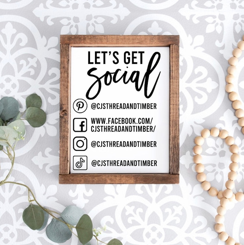 May include: A white wooden sign with the text "Let's Get Social" and social media handles for CJSTHREADANDTIMBER on Pinterest, Facebook, Instagram, and TikTok.