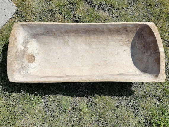 A genuine 19th-century hand-carved wooden bowl with authentic tool marks — functional history you can set on your dining table.