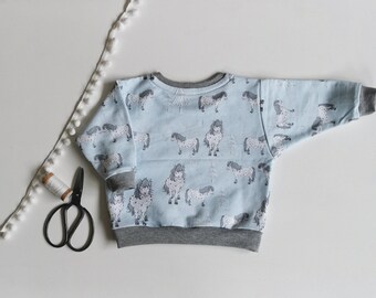 baby and toddler oversized sweater with ponies made of organic cotton