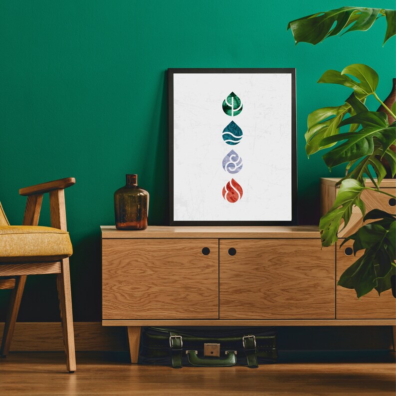 May include: A framed print with a white background and four colorful water drop symbols representing the four elements: earth, water, air, and fire. The print is hanging on a green wall above a wooden cabinet.