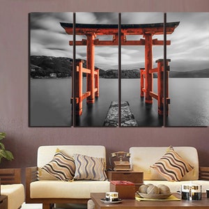 May include: A three-panel canvas print featuring a red Japanese Torii gate, a traditional gateway to Shinto shrines, standing in a black and white landscape. The gate is partially submerged in water, creating a sense of mystery and tranquility.