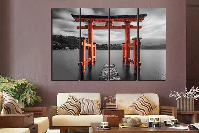 May include: A three-panel canvas print featuring a red Japanese Torii gate, a traditional gateway to Shinto shrines, standing in a black and white landscape. The gate is partially submerged in water, creating a sense of mystery and tranquility.