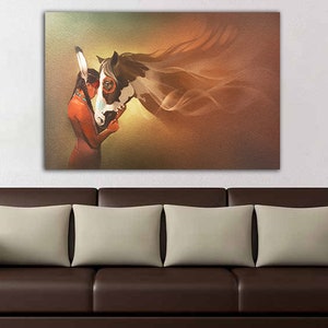 May include: A painting of a Native American woman in traditional clothing embracing a white and brown horse with flowing mane. The background is a soft brown and gold color.
