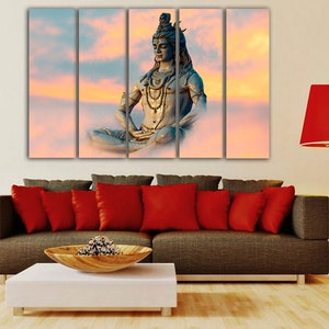 May include: A multi-panel canvas print featuring a meditating Hindu deity, Shiva, in a serene pose against a backdrop of clouds and a sunset sky.