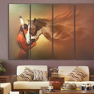 May include: A multi-panel canvas print featuring a Native American woman with a headdress, embracing a brown and white horse. The background is a soft, golden brown with a flowing, abstract design.