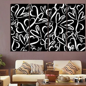 Puede incluir: Una impresi&oacute;n de arte de pared de lienzo en blanco y negro con un patr&oacute;n repetitivo de corazones blancos sobre un fondo negro. La impresi&oacute;n est&aacute; dividida en cuatro paneles.