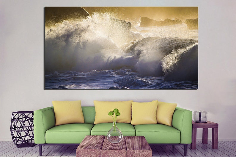 May include: A large canvas print featuring a dramatic seascape with crashing waves and a golden sky.