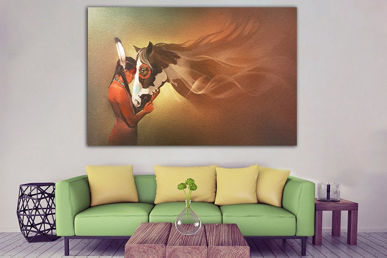 May include: A painting of a Native American woman with a headdress, embracing a brown and white horse with flowing mane. The background is a soft brown and yellow gradient.