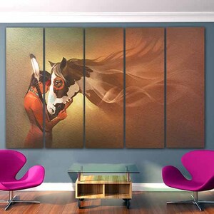 May include: A painting of a Native American woman with a feathered headdress, wearing a red and brown dress, touching noses with a white and brown horse. The horse's mane is flowing in the wind, and the background is a soft, brown and orange color.