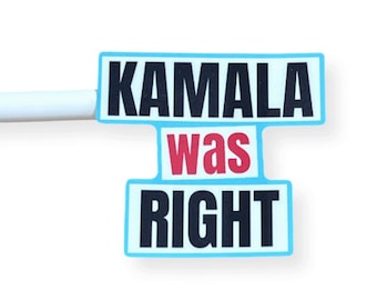 May include: A light blue and white rectangular sticker with the words "KAMALA WAS RIGHT" in black and red text. The sticker is attached to a white stylus.