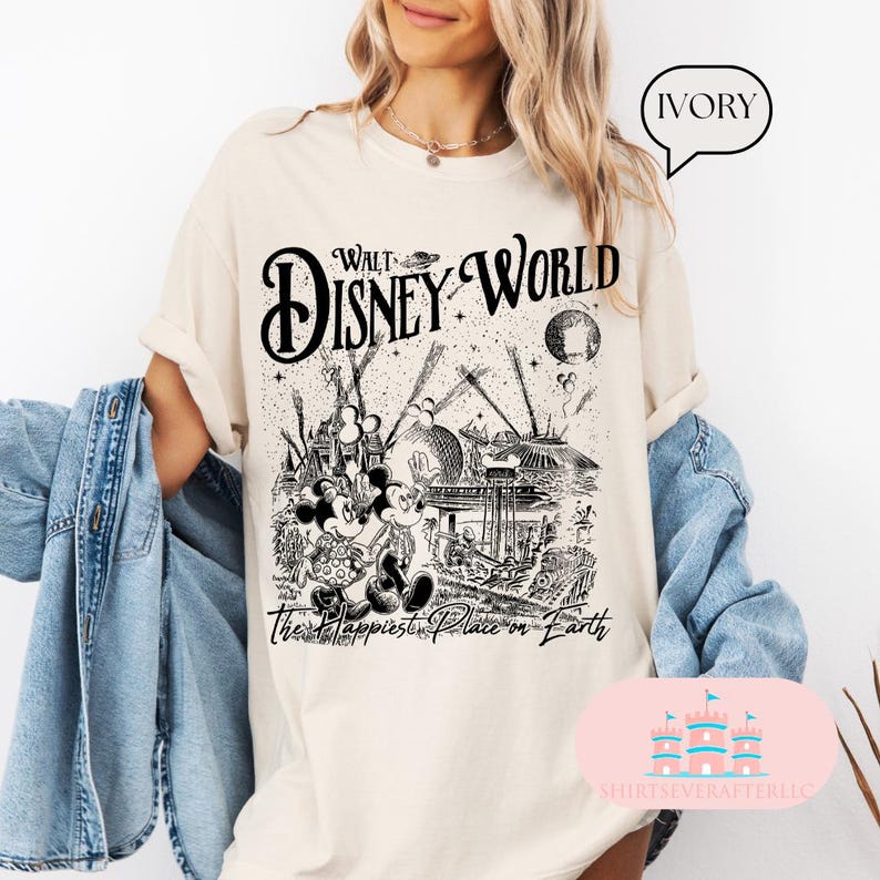 May include: Ivory-colored t-shirt featuring a black and white graphic of Walt Disney World. The design includes Mickey and Minnie Mouse, iconic park structures, and the text "Walt Disney World" and "The Happiest Place on Earth."