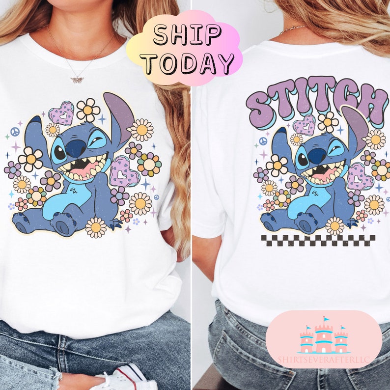 May include: White t-shirt with a blue Stitch character from Lilo & Stitch. Stitch is surrounded by flowers and hearts. The text "Stitch" is in purple and blue letters on the back of the shirt.