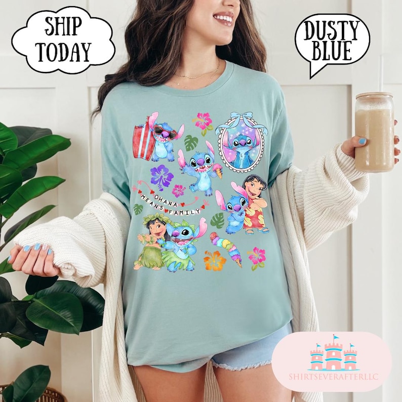 May include: A light blue t-shirt with a graphic print of Stitch and other characters from the Disney movie Lilo & Stitch. The shirt features the text "Ohana means family" and a variety of tropical flowers and leaves.