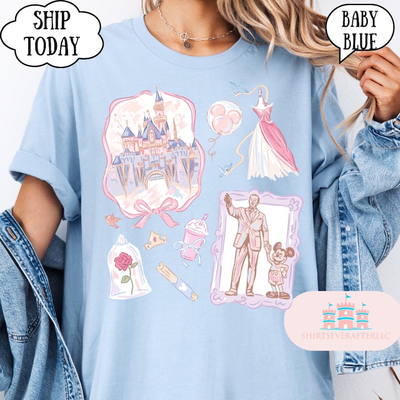 Op de afbeelding: Babyblauw T-shirt met roze en paarse illustraties, waaronder een kasteel, jurk en personages. Het shirt heeft de tekst "SHIP TODAY" en "BABY BLUE" in tekstballonnen. Het shirt heeft ook de tekst "SHIRTSEVERAFTER, LLC".