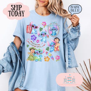 May include: Light blue t-shirt with a colorful print of Stitch characters from the Disney movie Lilo & Stitch. The shirt features Stitch in various poses, including holding an ice cream cone, wearing sunglasses, and hugging a friend. The text "Ohana means family" is also included in the print.