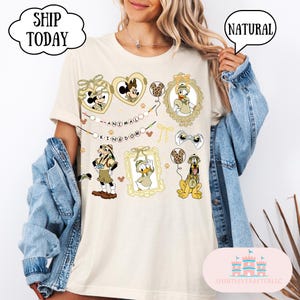 ミッキーと仲間たちのレオパード柄コケットリボンハートロケットコンフォートカラーブラストTシャツ、アニマルキングダム、ディズニーサファリモードTシャツ、ディズニーランド旅行