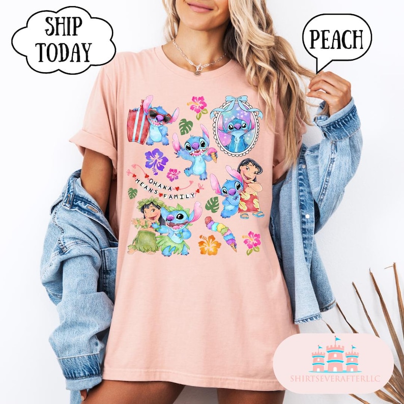 May include: Peach colored t-shirt with a graphic print of Stitch and other characters from the Disney movie Lilo & Stitch. The text "Ohana means family" is printed on the shirt.
