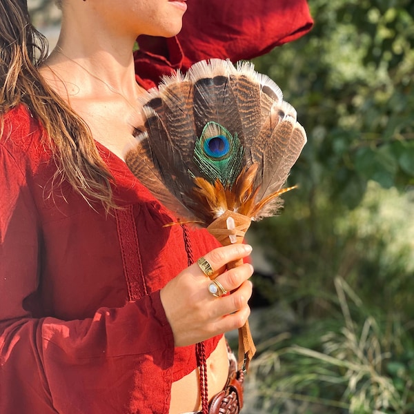 Handcrafted shamanic fan of natural feathers, with leather and hyaline quartz