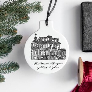 May include: White ceramic ornament with a black and white illustration of a building and the text "The Union League of Philadelphia".