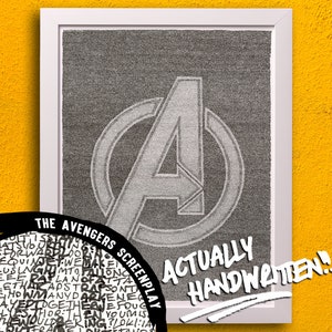 May include: A framed print of the Avengers logo, made entirely of handwritten text. The text reads "THE AVENGERS SCREENPLAY ACTUALLY HANDWRITTEN!"