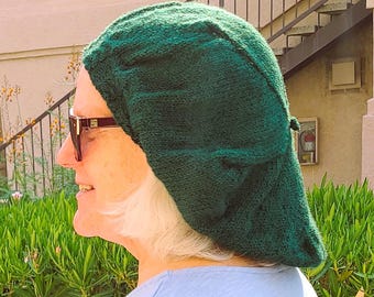 Gebreide baret van bosgroene wol