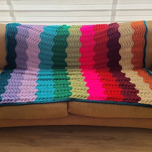 Knit afghan in retro multi-colored stripes