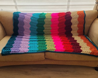 Knit afghan in retro multi-colored stripes
